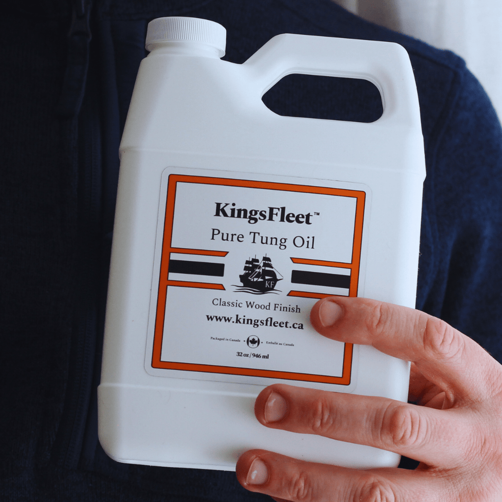KingsFleet Pure Tung Oil, 32oz, in hand. With labels highlighting. No additives, Zero VoCs, Pure Tung Oil.