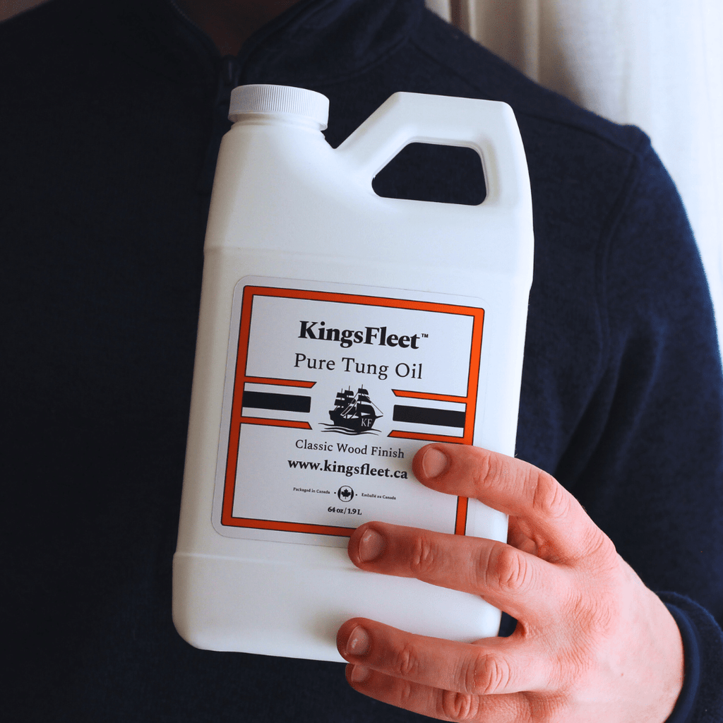 KingsFleet Pure Tung Oil, 64oz, in hand. With labels highlighting. No additives, Zero VoCs, Pure Tung Oil.